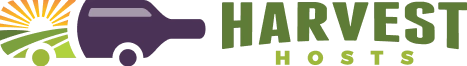 Logo with a purple truck, sunrise, green fields, and the text "HARVEST Hosts" in green and yellow.